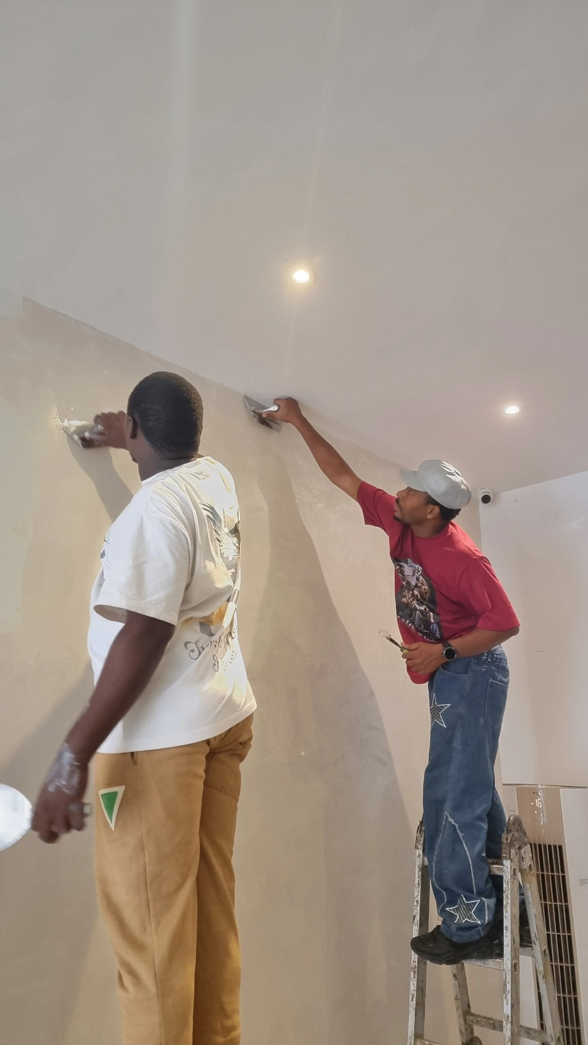 Professional painter applying OFPAD paint